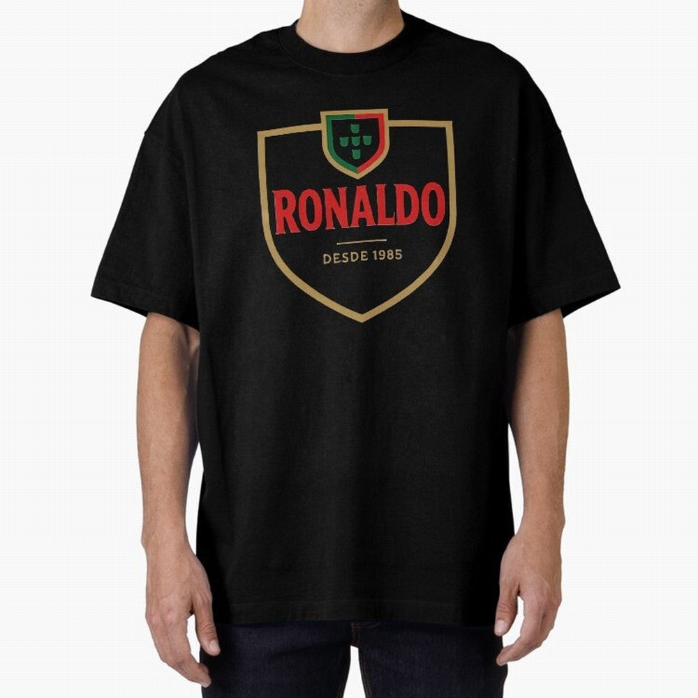Ronaldo Emblem Sticker ¨C Gold Crest Parody Design Oversized T-Shirt Unlock FIFA World Cup 2026 with Messi, CR7 and Mbappe, Netherlands Energy, Championship Spirit, Famous Goals, Roaring Crowds and International Football Unity; Perfect for